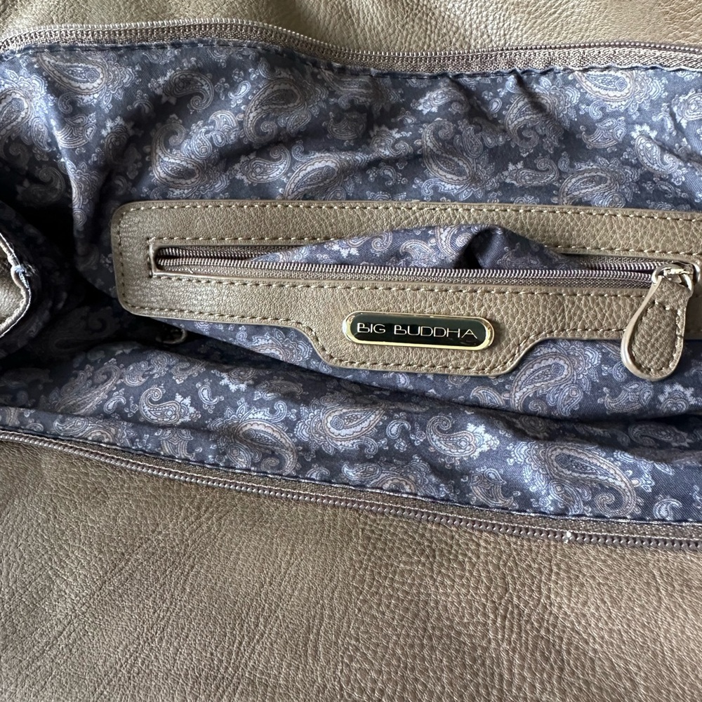Large bag, gold studs, back pocket ,two compartments inside the bag.